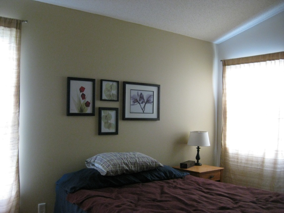 bedroom accent wall with artwork